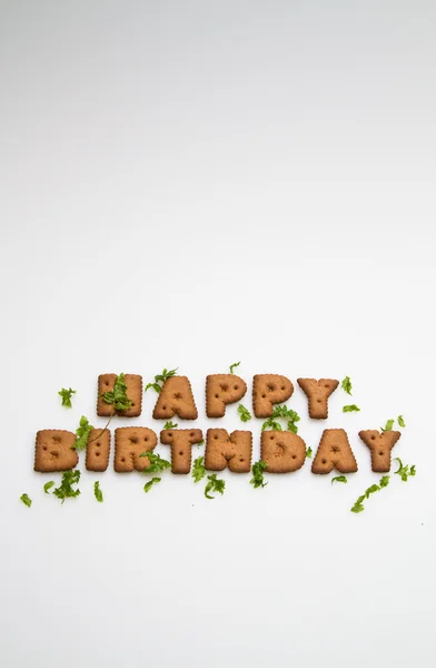 Gelukkige verjaardag door koekjes en bladeren ii — Stockfoto