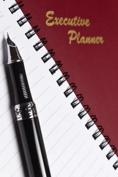 Planejador Executivo com Nota Livro IV — Fotografia de Stock
