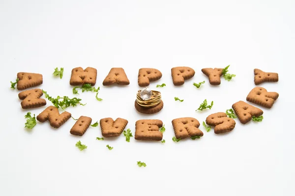 Anniversary - Biscuits, Leaves and Diamond Ring — Stock Photo, Image