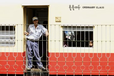 Passengers aboard train in Yangon, Myanmar clipart