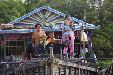 Cambodian Family on House Boat clipart