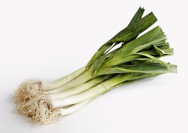 A bunch of leeks isolated on a white background