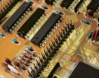 The modern printed-circuit board with electronic components macr clipart