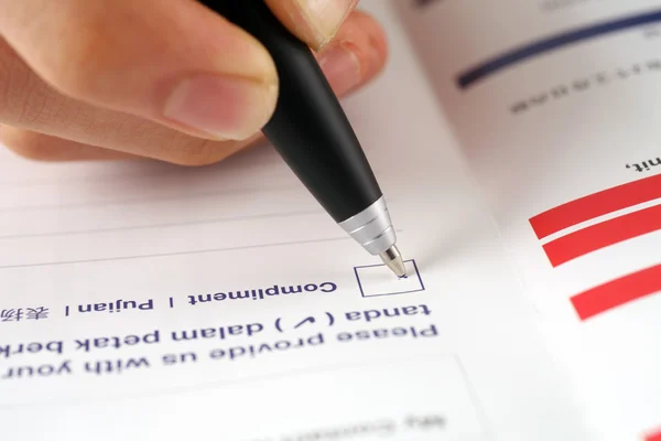 Pen marking check boxes, about compliment — Stock Photo, Image