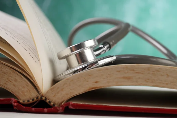 stock image Stethoscope resting on the book