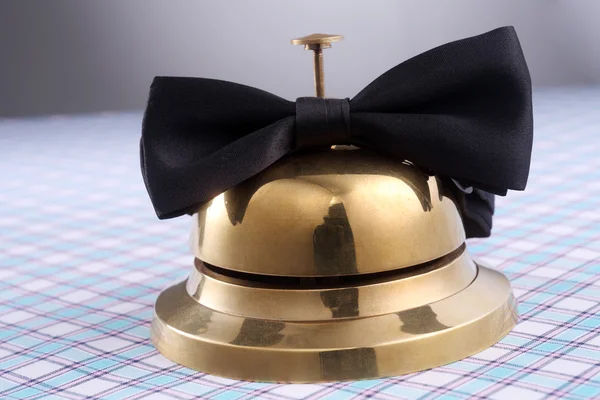 Service bell and bowtie — Stock Photo, Image