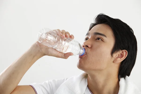 stock image Man drinking water from bottle