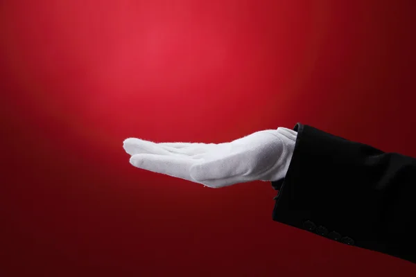 Vista lateral de la mano con guante blanco — Foto de Stock