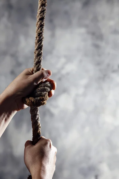 stock image Hand holding rope