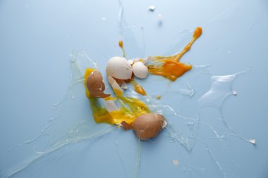 Egg yolk and egg white splattered clipart