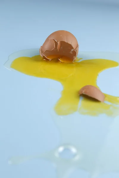 stock image Egg yolk and egg white splattered