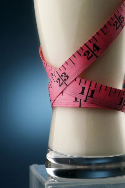 Milk and measuring tape — Stock Photo, Image