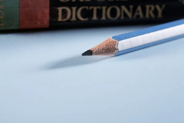 Pencil and dictionary — Stock Photo, Image
