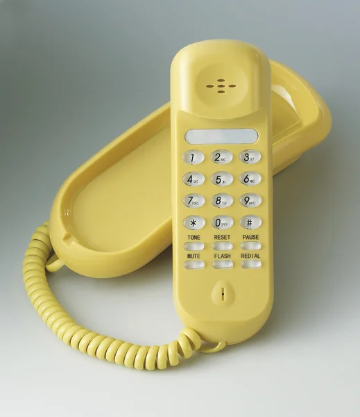 Żółty telefon — Zdjęcie stockowe
