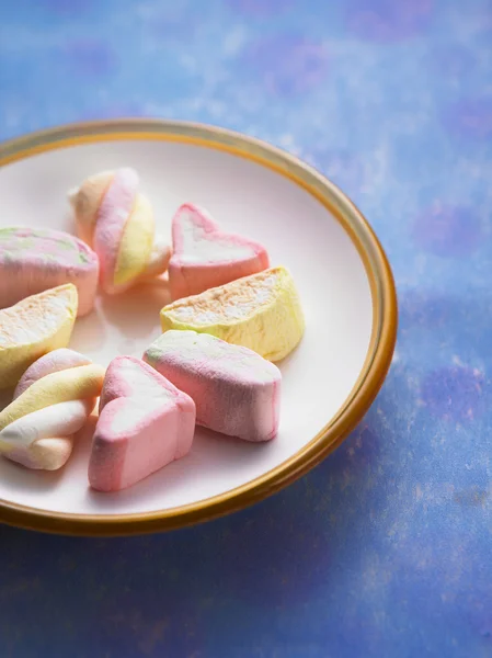 Close up plate of marshmallow on the blue color background — Stock Photo, Image