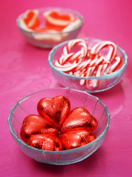 Candy on the the plate on the red color background — Stock Photo, Image