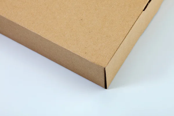 Bruine kleur cardbox op de vlakte kleur achtergrond — Stockfoto