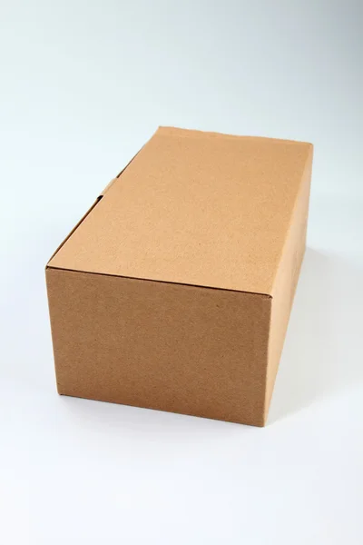 Brown cardboard box on the plain background — Stock Photo, Image