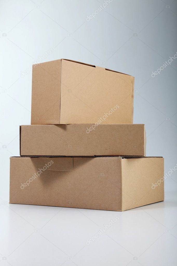 Few boxes stacked on the plain color background
