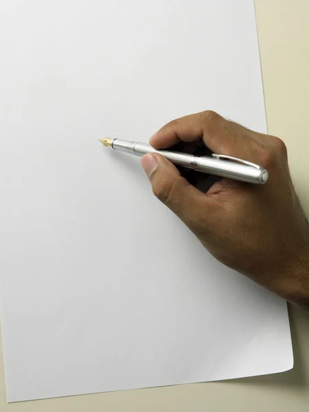 Close up of hand holding pen writing — Stock Photo, Image