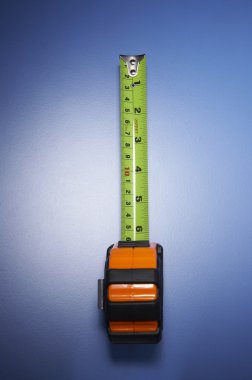 Measuring tape on the blue background clipart