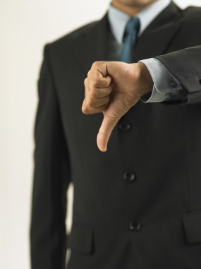 Businessman showing handsign no good clipart