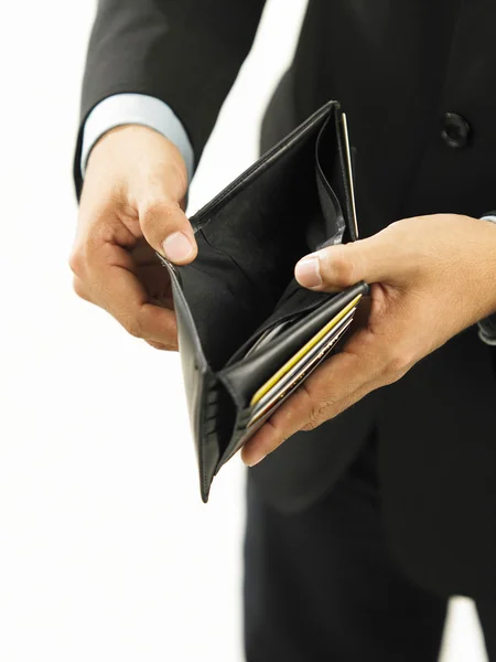 A man with suit showing his empty wallet — Stock Photo, Image