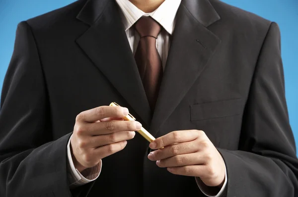 Man holding a pen — Stock Photo, Image