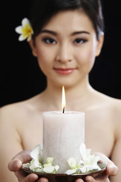 Candle with flower petals — Stock Photo, Image