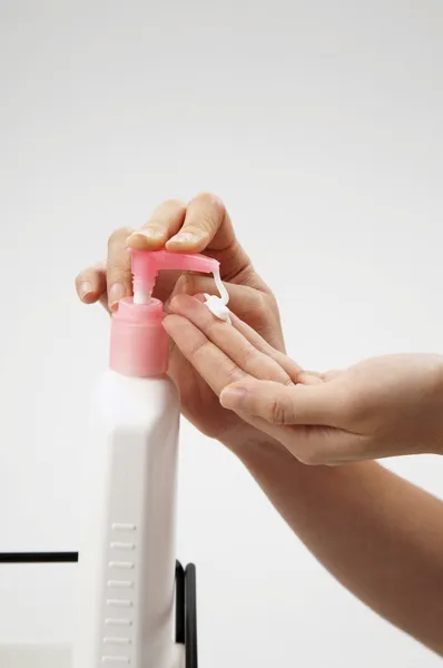 Stock image Close up on woman using hand cream