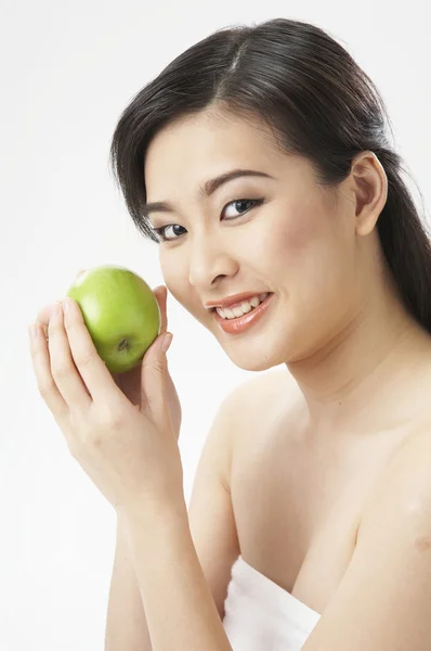 stock image Young woman holding apple