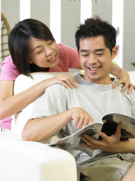 Young man being massage by his spouse — Stock Photo, Image
