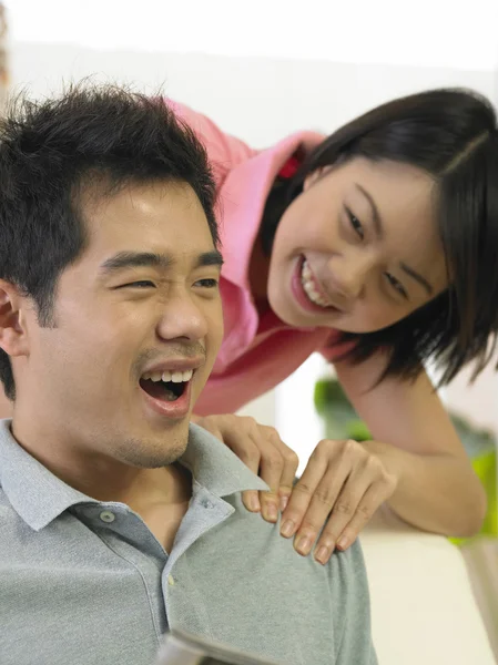 Young man being massage by his spouse — Stock Photo, Image