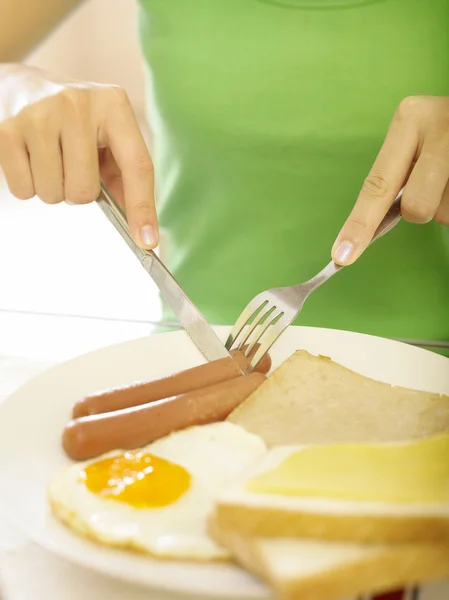 A young lady having her english breakfast — Stock Photo, Image