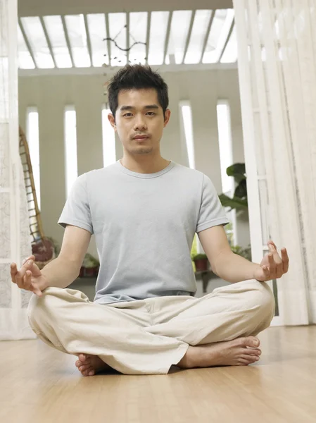 Man in his yoga position — Stock Photo, Image