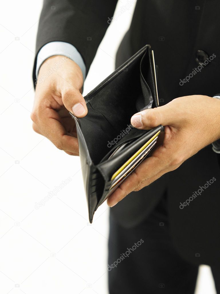 A man with suit showing his empty wallet