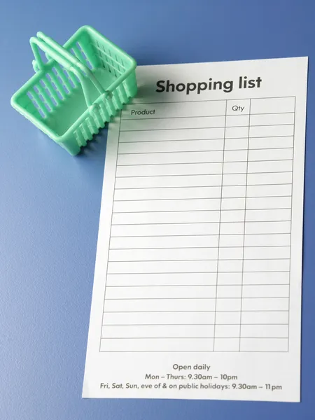 Mini shopping basket and shopping list — Stock Photo, Image