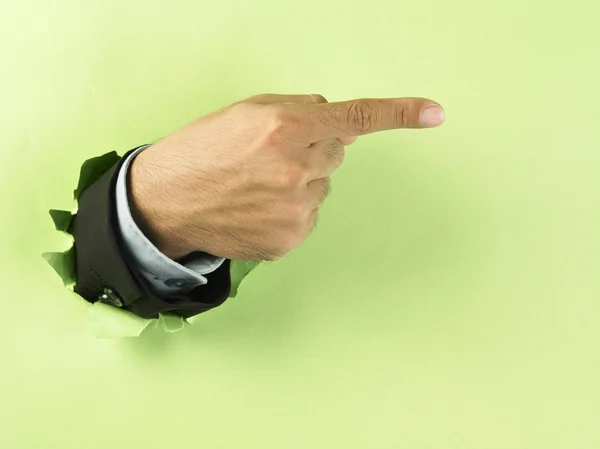 Hand breaking through paper — Stock Photo, Image