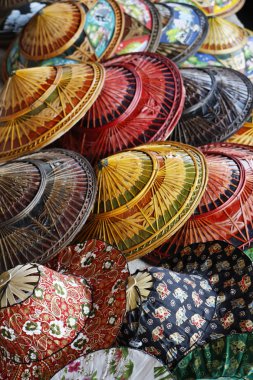 Thailand, Bangkok, Floating Market, Thai hats for sale on a boat clipart