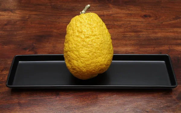 Stock image Citron (Citrus medica) on a wooden table