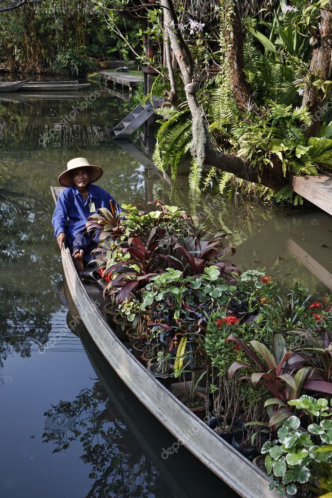 Thailand Bangkok The Rose Garden A Thai Gardener Carries Some