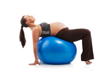 Pregnant woman doing exercises clipart