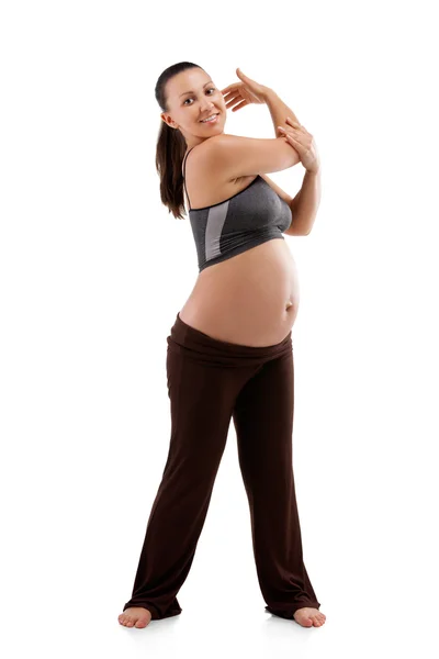 Hermosa mujer embarazada haciendo ejercicios — Foto de Stock