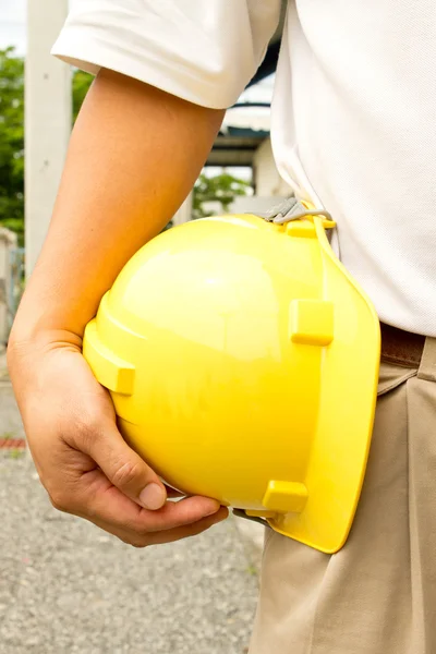 Yellow helmet. The background is white Description:Yellow helmet. The backg — Stock Photo, Image