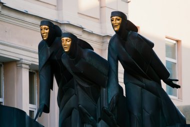 Three Graces on the roof of the dramatic theater. Vilnius. Lithu clipart