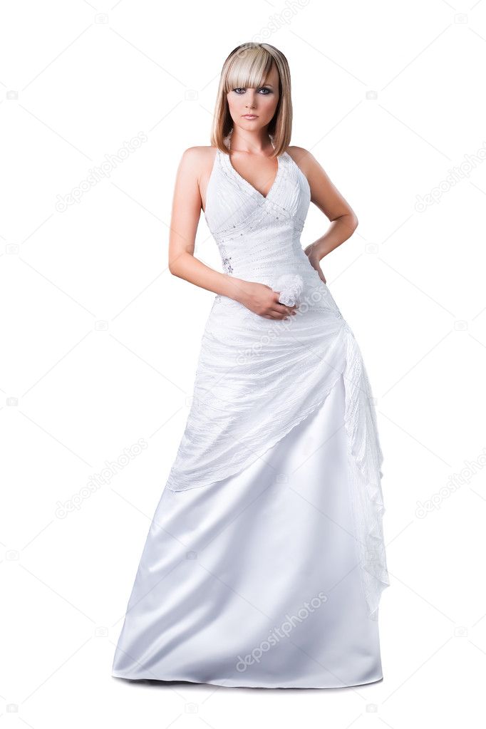 Confident blond bride wearing wedding dress isolated over white