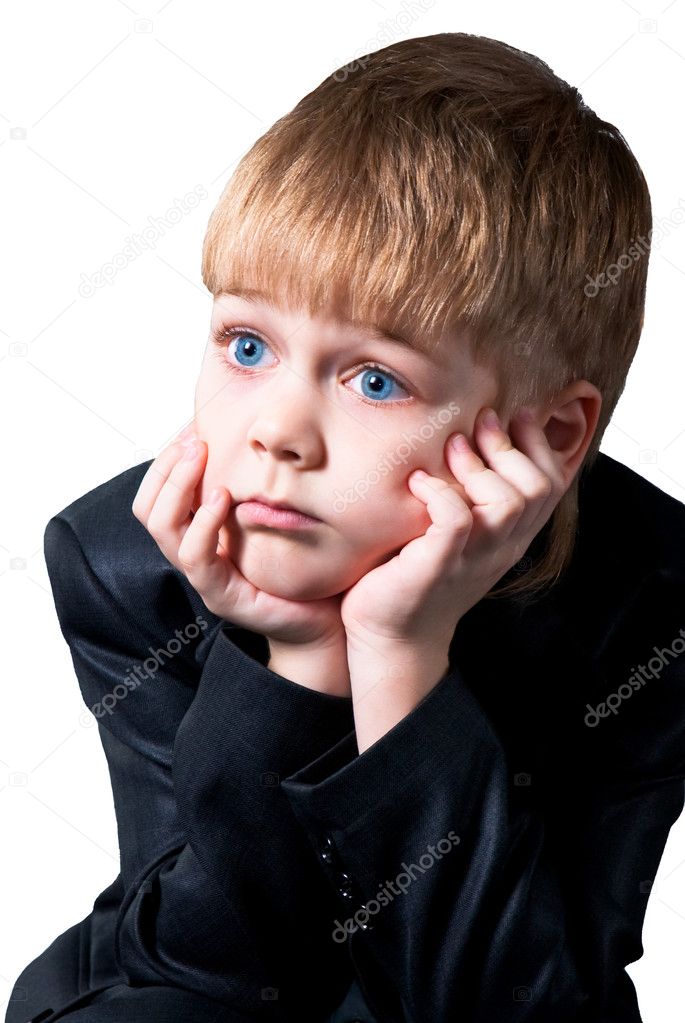 Wondering schoolboy face isolated on white background