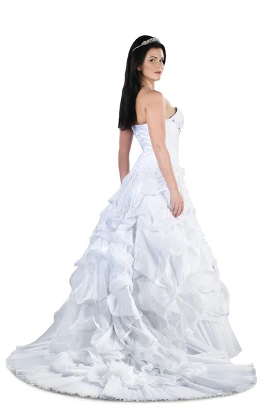 Prachtige brunette bruid in jurk geïsoleerd op witte achtergrond — Stockfoto
