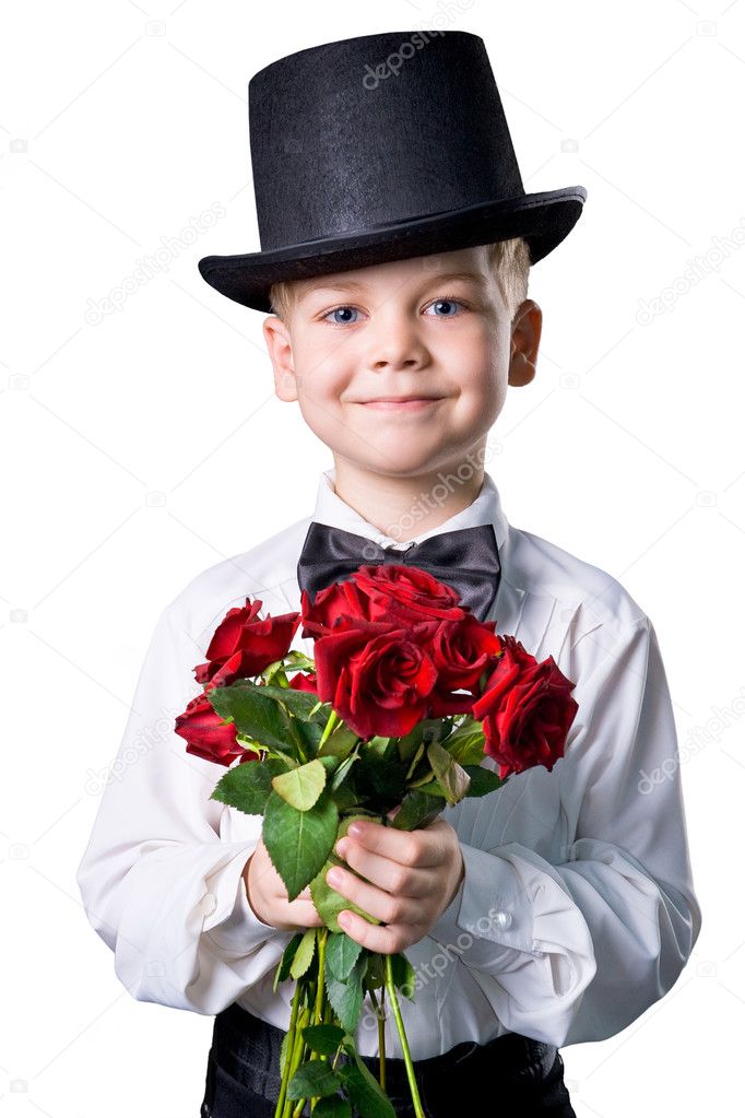 Handsome boy in classic suit with flowers isolated on white back
