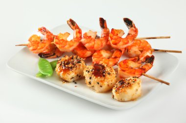 Sesame ginger scallop with hoisin sauce and Shrimp Skewers clipart